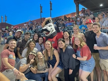 Members of the Class of 2024 having fun at a Travelers game!  Back: Wesley Wells, Blake Mitchell, Mary Selanders, Madison Lloyd, (Mascot “Ace”), Audrey Roberts, Maggie Boles, Parker Work, Landen Saling  Center:  Megan Wilson, Emily Housley, Marina Davenport, Miriam Tovar-Chavez, Alyson White  Front: Patric Waymire, Devon Rice 