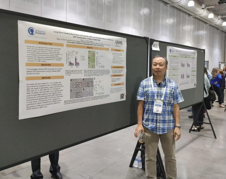 Dr. Wei Li showing his poster